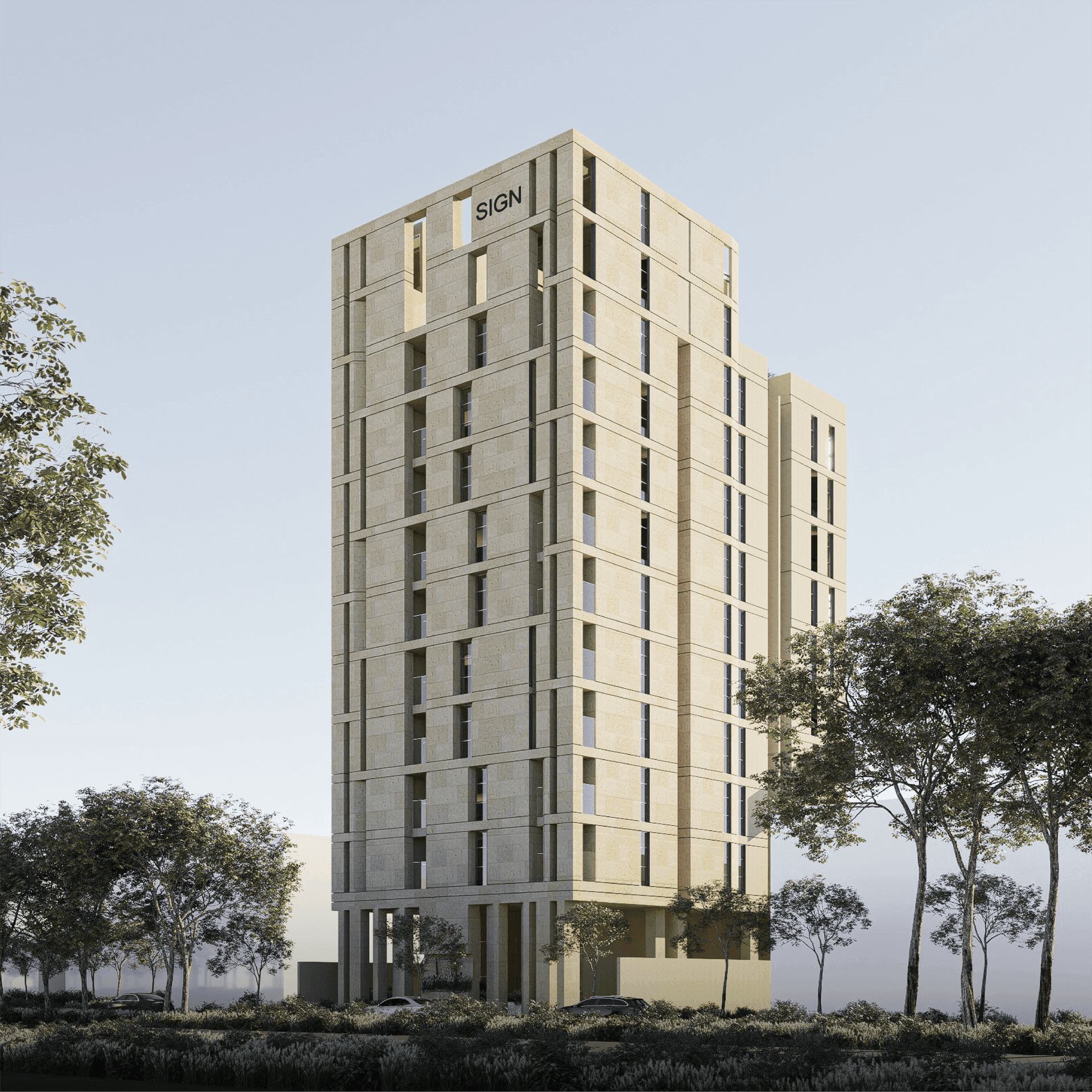 Modern high-rise beige building with trees in the foreground against a clear sky.